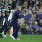 Seattle Seahawks head coach Pete Carroll applauds during the second half of NFL Super Bowl XLIX football game against the New England Patriots on Sunday, Feb. 1, 2015, in Glendale, Ariz. (AP Photo/Matt Rourke)