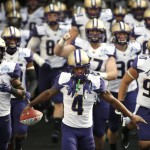 Washington wide receiver Jaydon MIckens (4) and his team arrive on the field before taking on Southern Mississippi in the Heart of Dallas Bowl NCAA college football game, Saturday, Dec. 26, 2015, in Dallas. (AP Photo/Ron Jenkins)