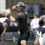 Southern Mississippi quarterback Nick Mullens (9) looks for an open receiver against Washington during the first half of the Heart of Dallas Bowl NCAA college football game, Saturday, Dec. 26, 2015, in Dallas. (AP Photo/Ron Jenkins)