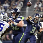 Dallas Cowboys' David Irving (95) is defended by Seattle Seahawks' Drew Nowak (62) as Seahawks quarterback Russell Wilson (3) throws a pass in the second half of an NFL football game Sunday, Nov. 1, 2015, in Arlington, Texas. (AP Photo/Michael Ainsworth)