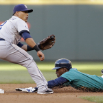 San Diego Padres shortstop Everth Cabrera, left, waits for the ball as Seattle Mariners' James Jones slides safely into second base on a stolen base in the first inning during a baseball game Monday, June 16, 2014, in Seattle. (AP Photo/Elaine Thompson)