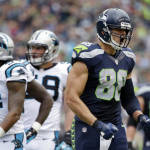 Seattle Seahawks tight end Jimmy Graham, right, reacts after catching a pass for a first down against the Carolina Panthers in the first half of an NFL football game, Sunday, Oct. 18, 2015, in Seattle. (AP Photo/Elaine Thompson)