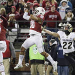 Washington State safety Taylor Taliulu (30) intercepts a pass in front of teammate cornerback Marcellus Pippins (27) and Colorado wide receiver Nelson Spruce (22) during the second half of an NCAA college football game, Saturday, Nov. 21, 2015, in Pullman, Wash. Washington State won 27-3. (AP Photo/Young Kwak)