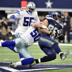 Dallas Cowboys outside linebacker Sean Lee (50) tackles Seattle Seahawks tight end Jimmy Graham (88) on a pass play in the first half of an NFL football game Sunday, Nov. 1, 2015, in Arlington, Texas. (AP Photo/Michael Ainsworth)