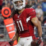Arizona Cardinals wide receiver Larry Fitzgerald (11) celebrates his touchdown against the Seattle Seahawks during the first half of an NFL football game, Sunday, Jan. 3, 2016, in Glendale, Ariz. (AP Photo/Rick Scuteri)