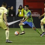 Seattle Sounders forward Clint Dempsey, center, works between Club America's Pablo Aguilar, left, and Paolo Goltz during the second half of a CONCACAF Champions League soccer quarterfinal, Tuesday, Feb. 23, 2016, in Seattle. The match ended in a 2-2 draw. (AP Photo/Ted S. Warren)