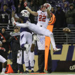 Utah defensive back Chase Hansen (22) breaks up a pass intended for Washington tight end Joshua Perkins, left, during the second half of an NCAA college football game, Saturday, Nov. 7, 2015, in Seattle. Utah won 34-23. (AP Photo/Ted S. Warren)