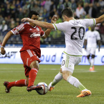 Seattle Sounders defender Zach Scott, right, stops a shot by Club Tijuana's Alfredo Moreno during the first half of an international friendly soccer match, Tuesday, March 24, 2015, in Seattle. The match ended in a 2-2 tie. (AP Photo/Ted S. Warren)