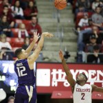 
              Washington's Andrew Andrews (12) shoots against Washington State's Ike Iroegbu (2) during the second half of an NCAA college basketball game, Saturday, Jan. 9, 2016, in Pullman, Wash. (AP Photo/Young Kwak)
            