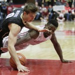 
              Colorado's Thomas Akyazili (0) and Washington State's Ike Iroegbu go after a loose ball during the first half of an NCAA college basketball game Saturday, Jan. 23, 2016, in Pullman, Wash. (AP Photo/Young Kwak)
            