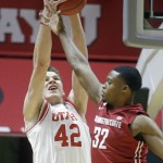 
              Utah forward Jakob Poeltl (42) catches a pass as Washington State guard Que Johnson (32) defends during the first half in an NCAA college basketball game Sunday, Feb. 14, 2016, in Salt Lake City. (AP Photo/Rick Bowmer)
            
