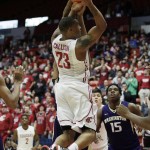 
              Washington State's Charles Callison (23) shoots against Washington's Marquese Chriss during the first half of an NCAA college basketball game, Saturday, Jan. 9, 2016, in Pullman, Wash. (AP Photo/Young Kwak)
            