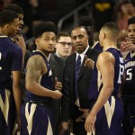               Washington head coach Lorenzo Romar, center, talks with his team during a break in play during the first half of an NCAA college basketball game against Southern California in Los Angeles, Saturday, Jan. 30, 2016. (AP Photo/Kelvin Kuo)
            