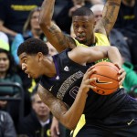               Washington's Marquese Chriss, foreground, battles Oregon's Elgin Cook for position under the basket during the first half of an NCAA college basketball game, Sunday, Feb. 28, 2016, in Eugene, Ore. (AP Photo/Chris Pietsch)
            