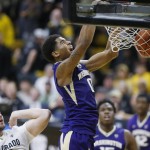               Washington forward Marquese Chriss, right, reacts as he dunks the ball for a basket over Colorado forward Kenan Guzonjic in the first half of an NCAA college basketball game Saturday, Feb. 13, 2016, in Boulder, Colo. (AP Photo/David Zalubowski)
            