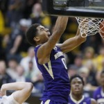               Washington forward Marquese Chriss, right, reacts as he dunks the ball for a basket over Colorado forward Kenan Guzonjic in the first half of an NCAA college basketball game Saturday, Feb. 13, 2016, in Boulder, Colo. (AP Photo/David Zalubowski)
            