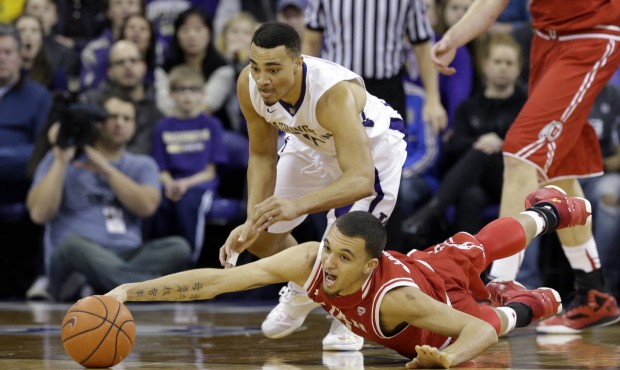 Utah knocked Washington from first place in the Pac-12 Conference with an 80-75 overtime win. (AP)...